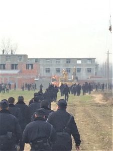The police fully armed and three excavating machines are destroying a church in China