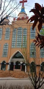 Church in Yingli with banner on the door.