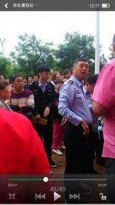 Policeman with believers.