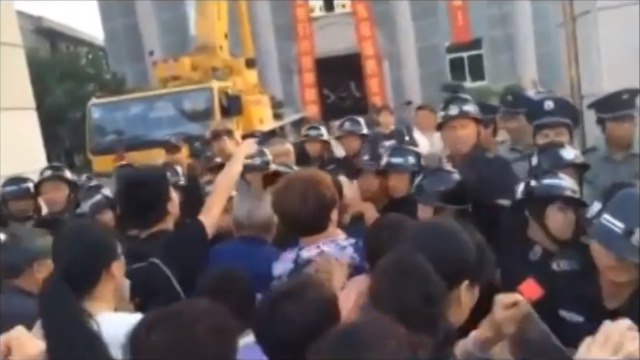 Congregants blocking the police from removing the cross