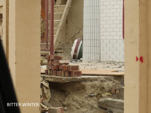 Courtyard in ruins, mosque dismantled