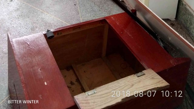 Indoor scene of the smashed-up gathering place; the podium was also destroyed