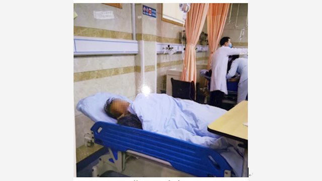 Mr. Zhou and his wife in the hospital