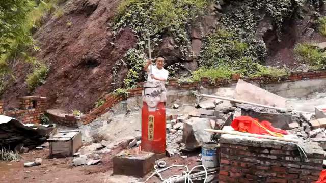 officer smashes Buddha statue