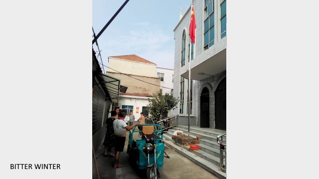 A Chinese flag is erected at a church in Xiguan village.