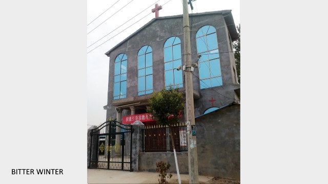 A cross sits atop Xumazhuang Church in Liudian township, Xiayi county, Henan Province.