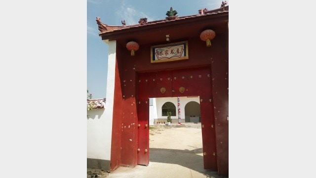 Gate of the “Farmers’ Book House” converted from the Taishan temple in Fengqiao town, Suiyang district, Shangqiu city, Henan Province on August 6, 2018.