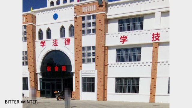 Main Buildings No. 1 to 3 in the front of the transformation through education camp. The windows on each building have been secured with steel bars.