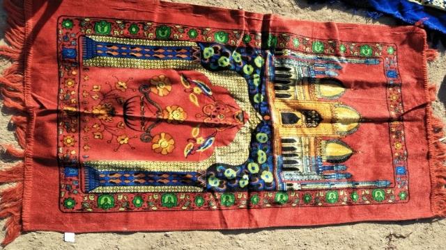 The pattern on this blanket resembles the shape of a mosque, and thus it is forbidden to be used