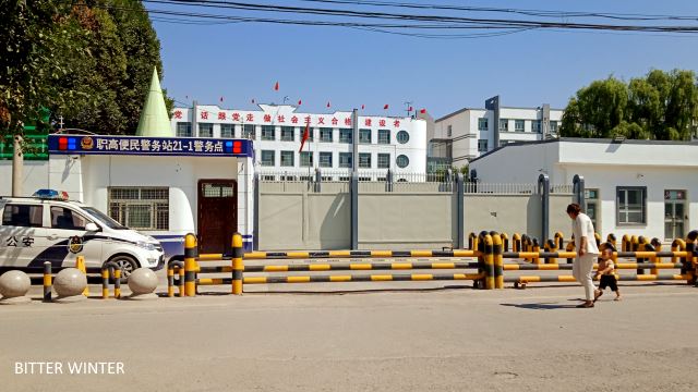 Qapqal Xibe county 3rd Middle School “transformation through education” camp’s front entrance and constable area, post-repurposing
