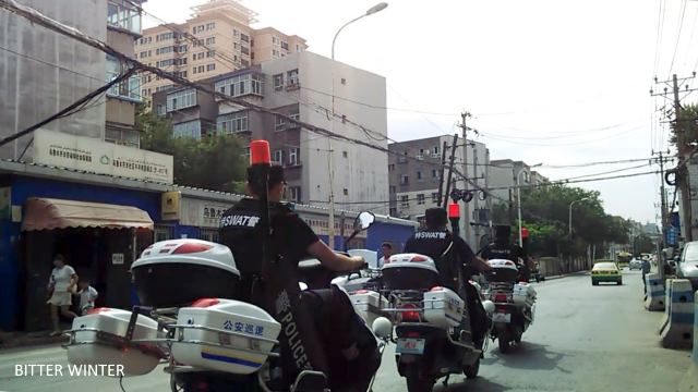 Riot police on motorcycles patrolling the area