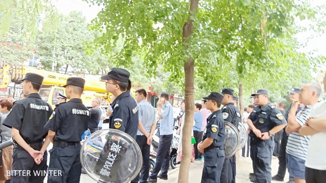 Special police control the site of the demolition