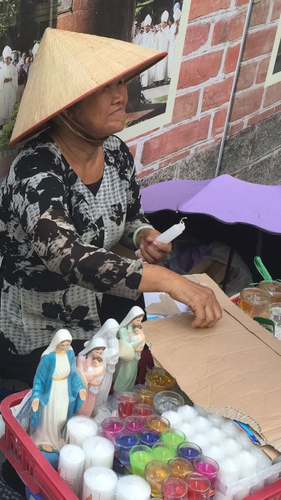 Street vendor of Catholic religious objects, Saigon. Vietnam