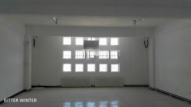 Surveillance cameras and LCD televisions are being installed in the room.
