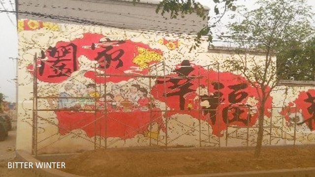 The “young girl” has been painted over and replaced by a mural depicting “family happiness.”
