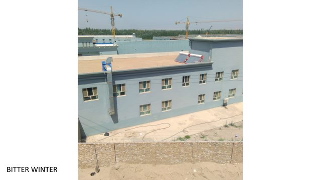 Unfinished two-story buildings inside the Chengnan “transformation through education camp.” Some windows have been closed, and the roof is under construction.