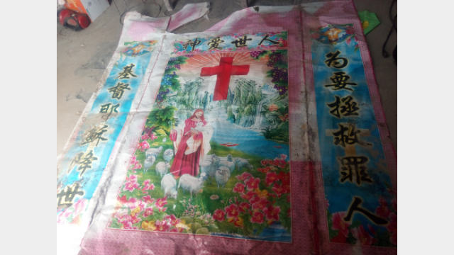 A religious picture forcefully taken down.