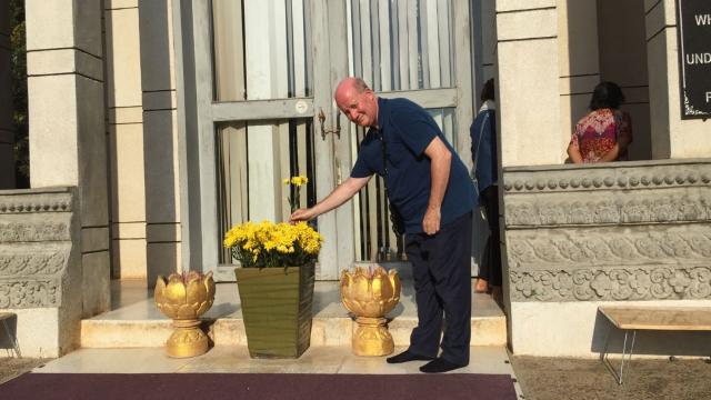 Bitter Winter’s editor-in-chief, Massimo Introvigne, offering flowers at the stupa in the Choeung Ek killing fields