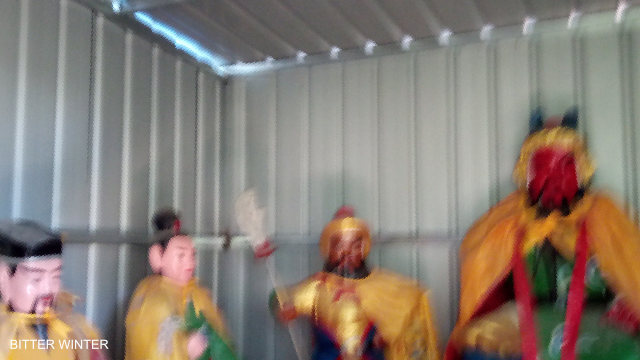 The Buddhists in the temple were taken away and put in a makeshift shed.