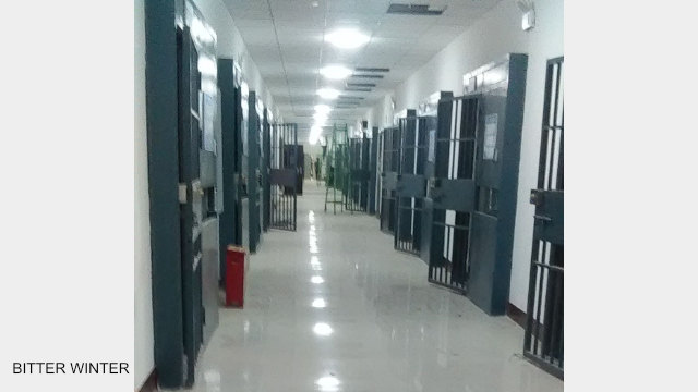 Internal view of the dormitory building in the transformation through education camp, where every room is fitted with double iron doors, just like a prison.