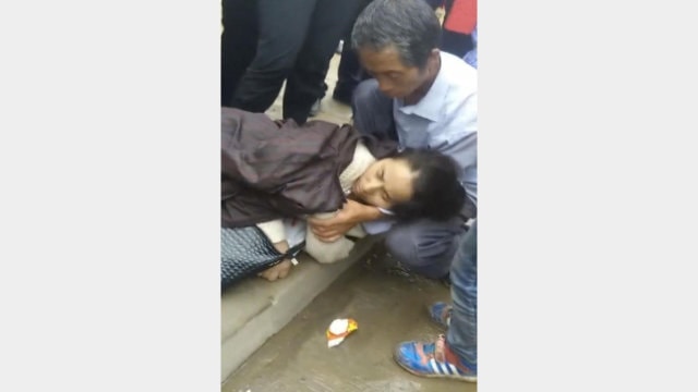 A believer is knocked unconscious.