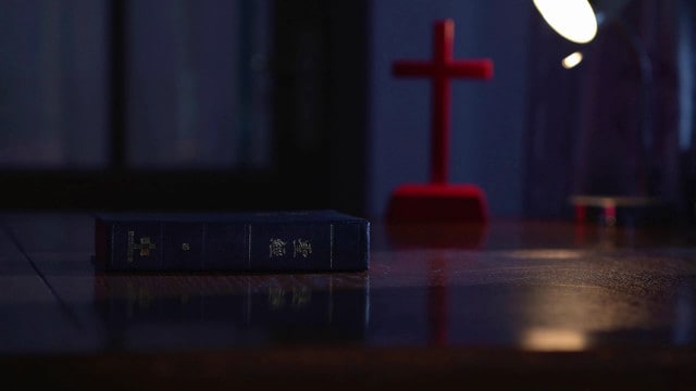 Bible and cross on the desk
