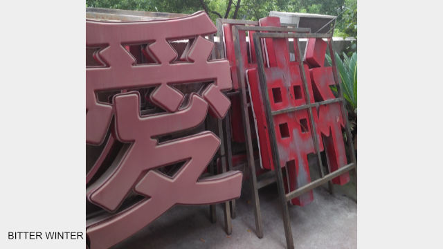 Christian slogans are taken down.