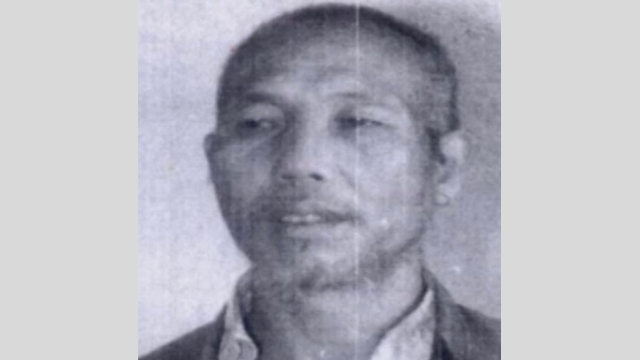 A police photograph of Ji Sanbao