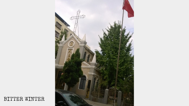 Chinese national flag replaces the cross