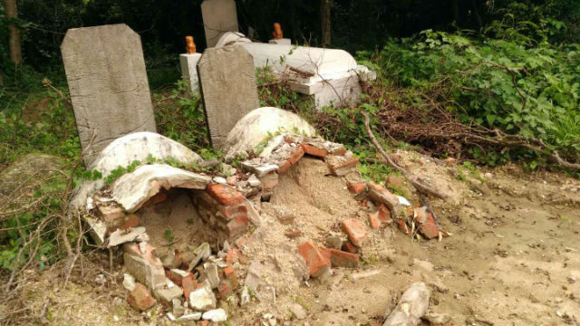 Government officials fare digging up the tombs.