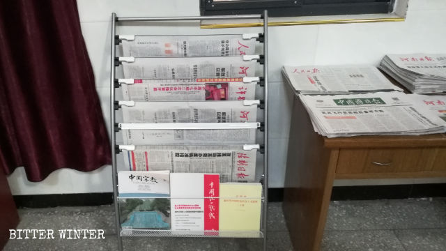 Newspapers are displayed in the church.