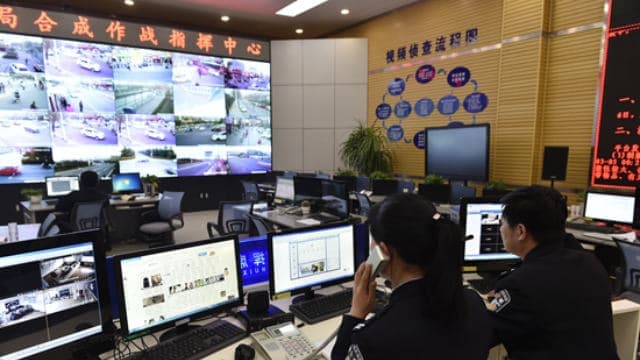 Police watching surveillance monitor