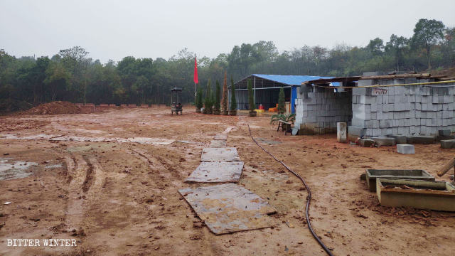 Two makeshift sheds next to the temple
