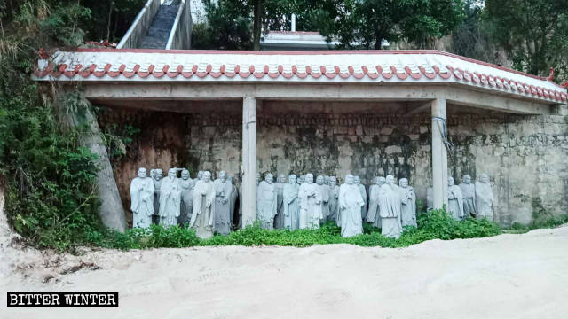 Arhat statues moved under the eaves