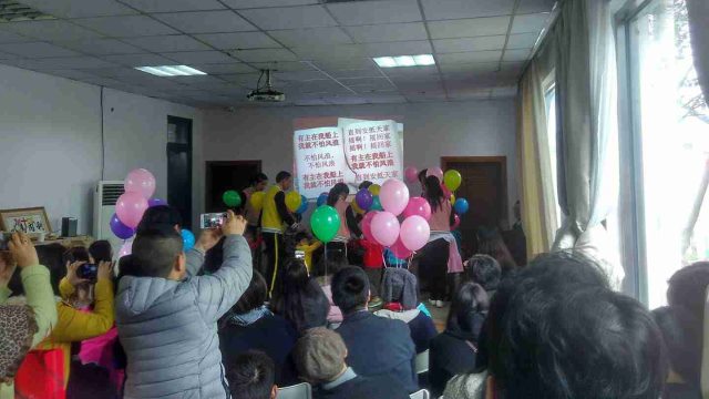 Christians hold a gathering with children at the orphanage.
