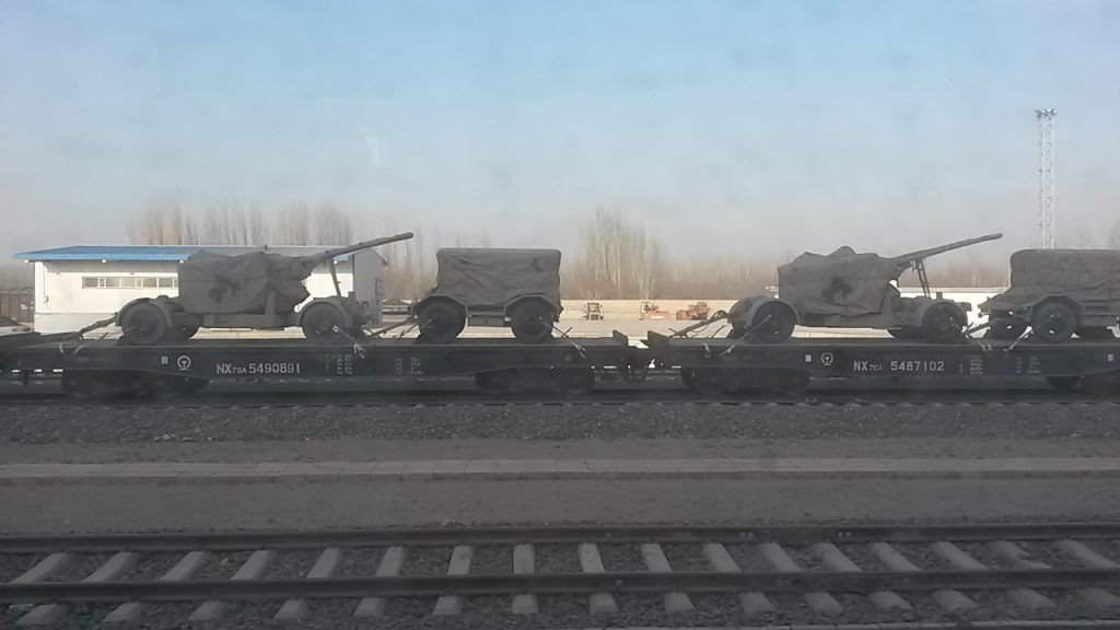 Field guns and ammunition trucks being moved by rail to Hotan for the build up of 'internal security' in the south of Xinjiang in November 2017.