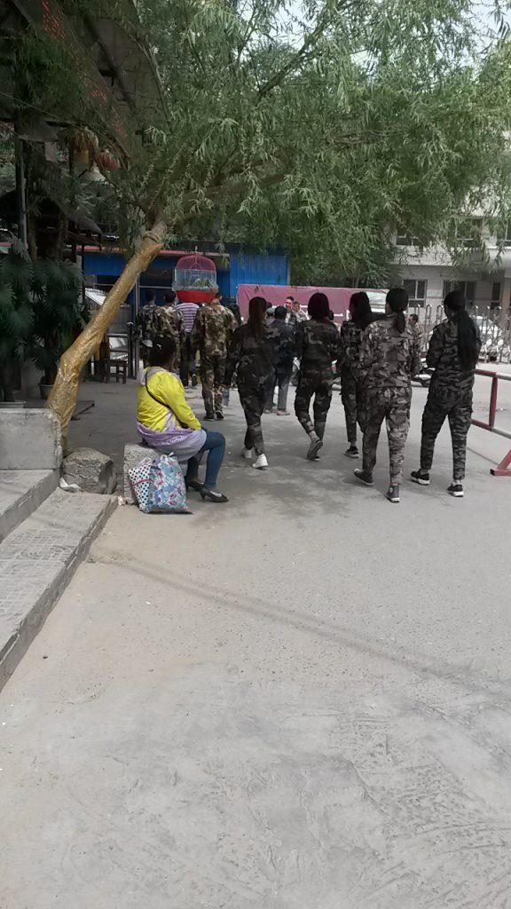High school students from Hotan in summer school uniforms; girls are not permitted to wear skirts this year.