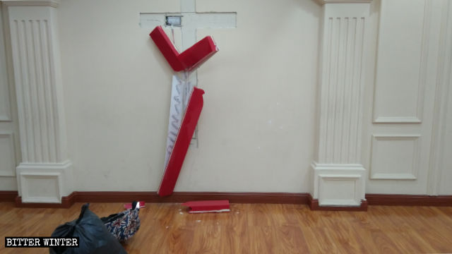 The cross in the meeting place is demolished