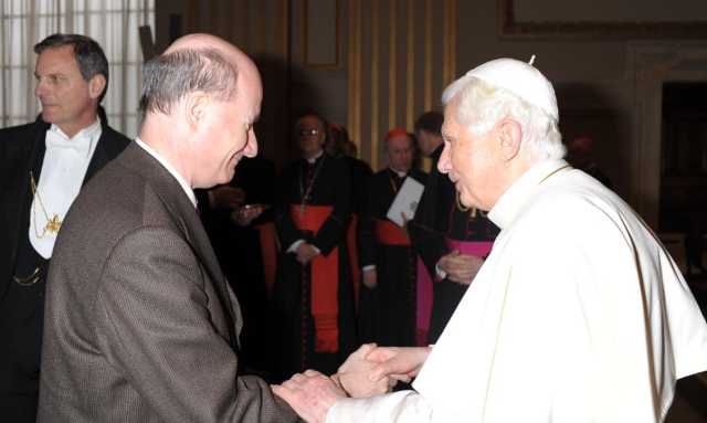 Pope Benedict XVI is congratulating Prof. Introvigne after he lectured at a Vatican-organized conference on the sociological study of the Catholic clergy on November 8, 2012.