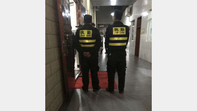 officers standing guard outside the church