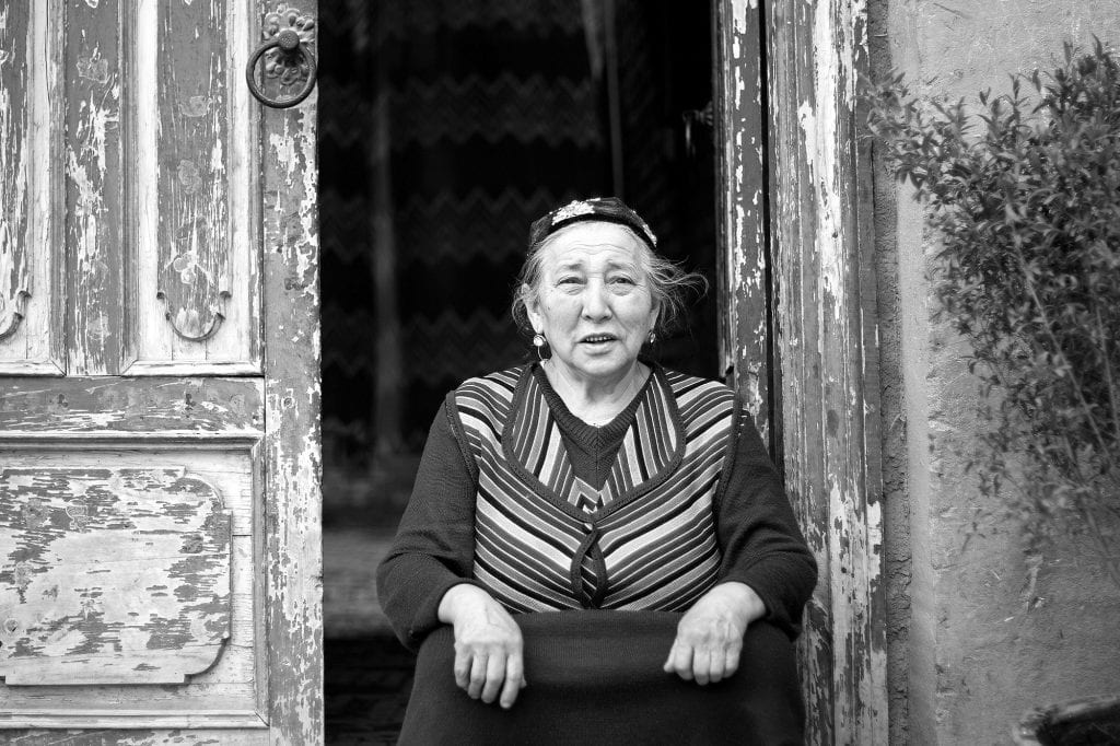 An Uyghur woman at her home’s door in Kashgar.
