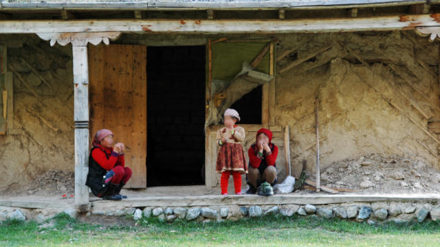 Women from Xinjiang live in a shabby house