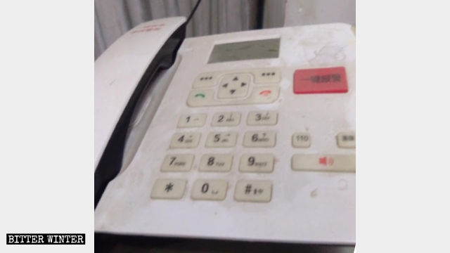 The one-button alarm covered in a layer of dust.