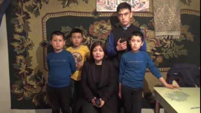 Attorney Aiman Umarova with orphan kazakh children