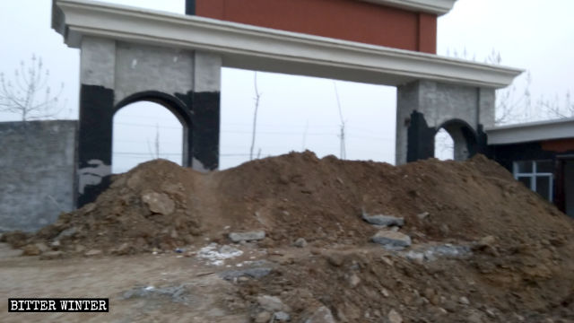 The church’s entrance is blocked off with soil.