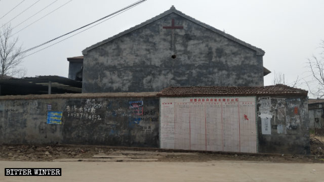 The cross on the exterior wall of Babu Church was destroyed.