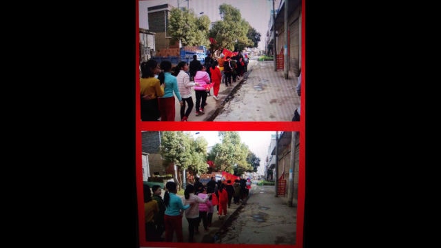 A primary school principal is leading his students’ march.