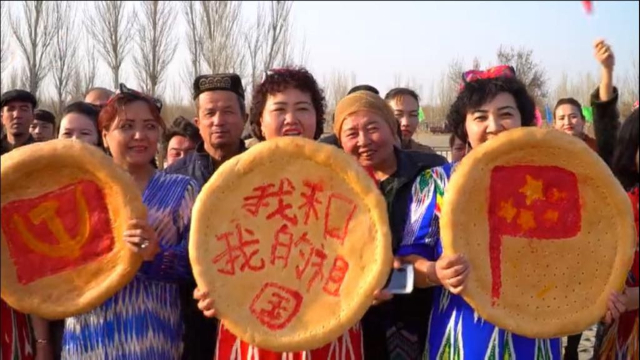 “Uyghur” “Nan” breads “decorated” left to right: the CCP hammer and sickle, slogan “me and my country” and the Chinese flag, during Spring celebrations in Turpan, Xinjiang.