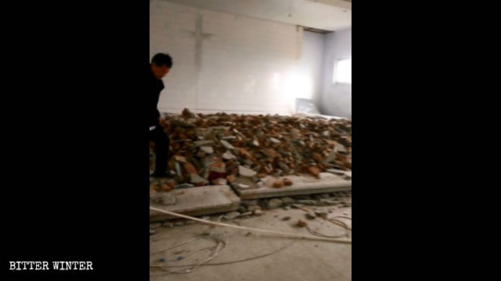 Scene of the dismantled flooring at the podium inside the church