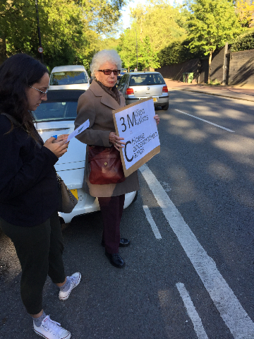Mrs. Judy Shipton and her granddaughter join the protest.